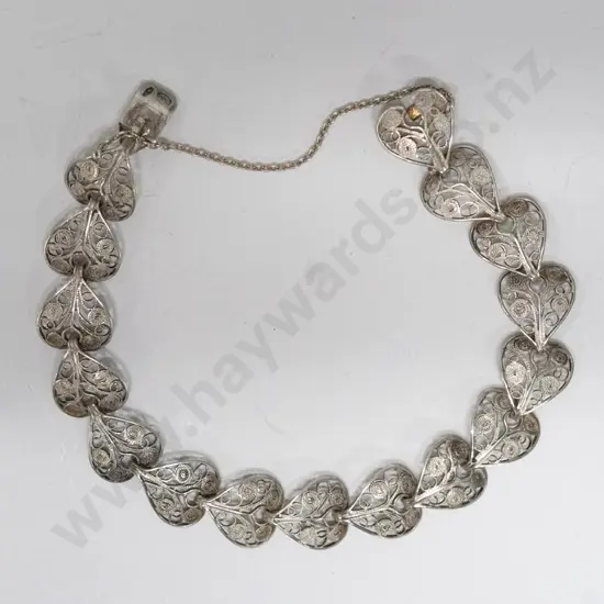 filagree bracelet with safety chain