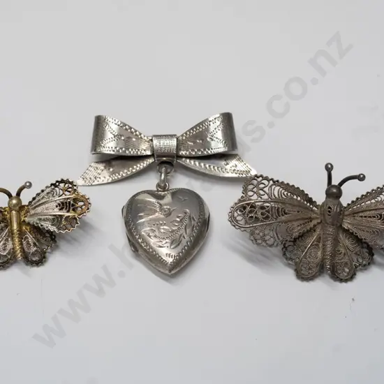 2 butterfly brooches & bow with locket brooch