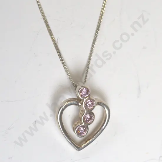 silver heart with 4 pink stones stamped 925