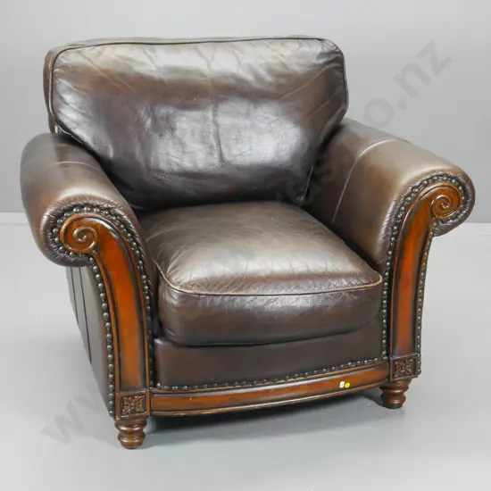 antiqued finish brown leather Chesterfield style club chair w/ carved timber facings H-880 W-1060 D-940