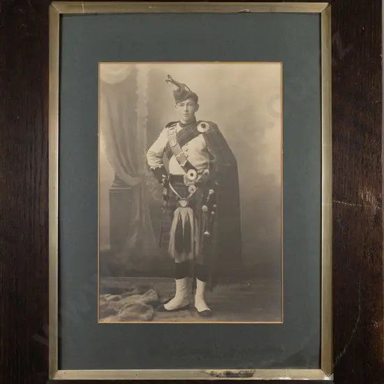 framed vintage black and white photograph - portrait of a bagpiper (slight aging) H-390 W-270