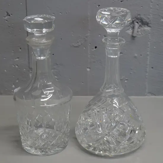 2 cut crystal stoppered decanters - taller one is H-280