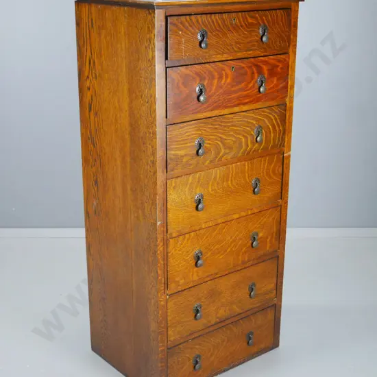 deco oak 7-drawer chest with original drop handles, some splitting and marks H-1280 W-610 D-480