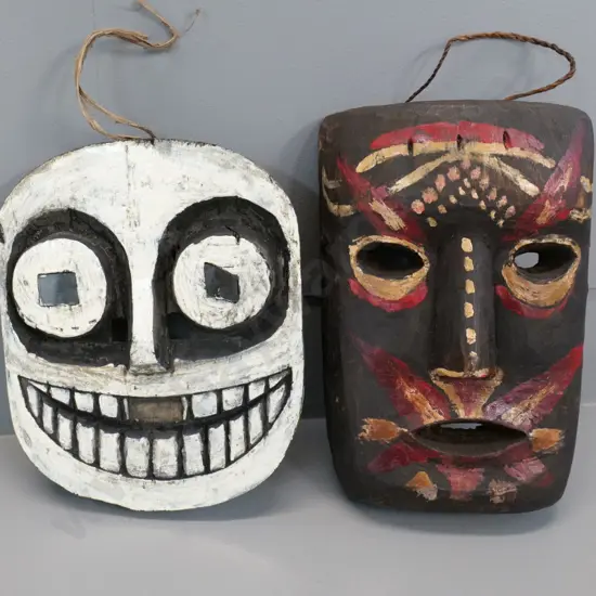 2 painted wood wall masks from Borneo - taller is H-250