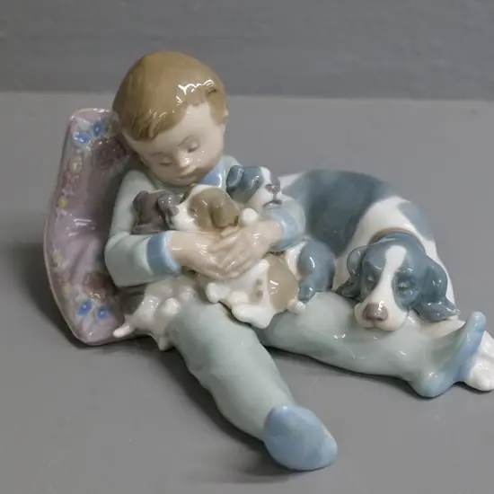 Lladro figurine - boy with dog & puppies - No. 1535. H-100 L-170 W-150