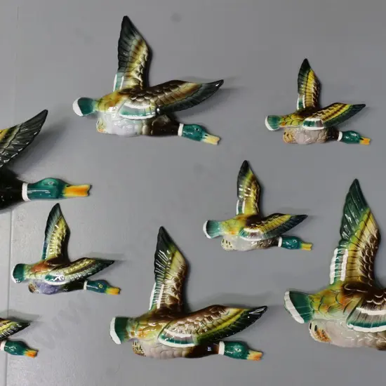 8 hand painted flying wall ducks - one with 'Ocean' Hand Painted label - two colour schemes. Largest is H-220 L-240