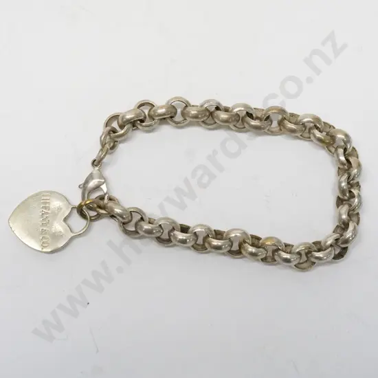 silver chain link bracelet with a heart stamped return toTiffany & Co New York 925