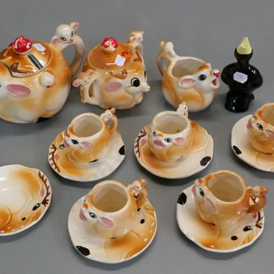 novelty Rudolph deer themed child's tea set, missing one cup, paint loss to knobs and noses & a blackbird pie funnel