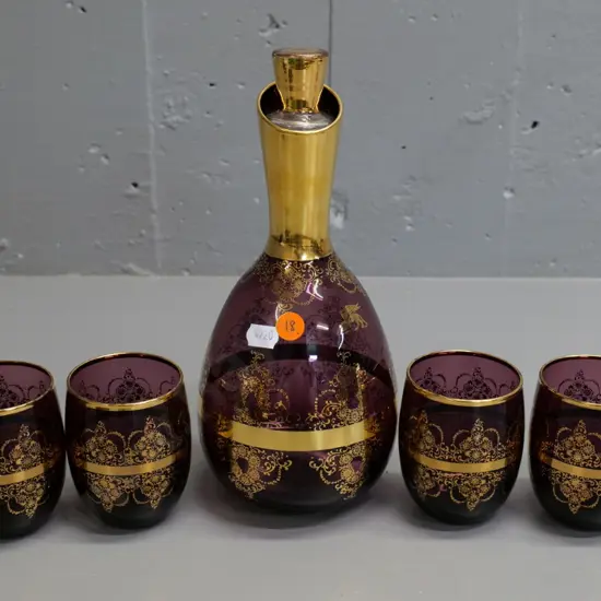 amethyst glass & gold design stoppered decanter w/4 tumblers - some rubbing to gilt