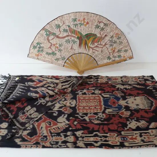 Indonesian Ikat figural fabric wall hanging approx. 2200 x 1120 and a wood and fabric fan with bird motif