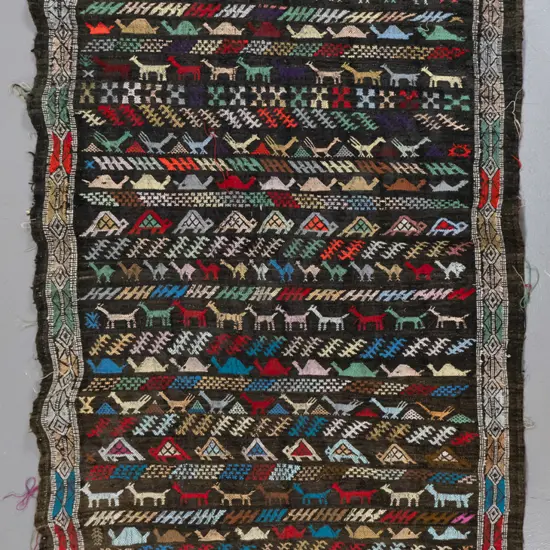 hand-knotted wool kilim floor rug - multi colour stylised animals, some fraying to sides L-1430 W-880