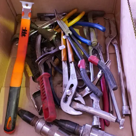 box of hand tools, vice grips, plumber's wrench etc