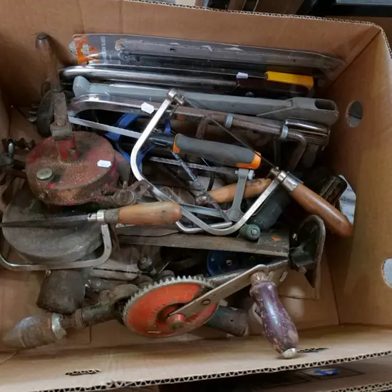 box; hacksaws, egg beater drills, hand operated sharpener etc