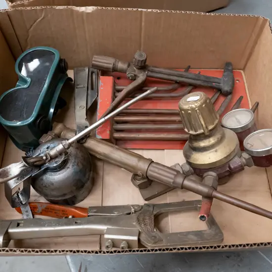 box of welding supplies; torches, goggles etc