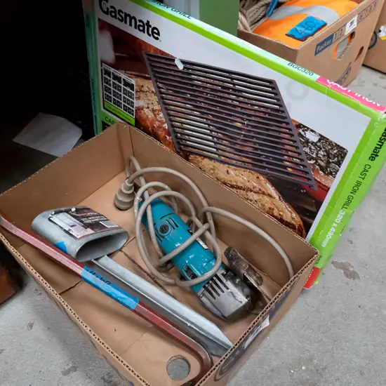 box; small wrecking bar, angle grinder, steel fencing spike, cast iron grill