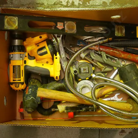 box; rubber mallet, battery drills, hammers, vice grips etc