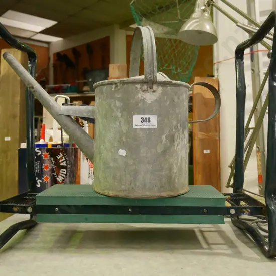 garden kneeler and watering can