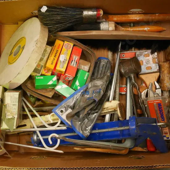 box; chainsaw chains, spark plugs, paint brushes etc