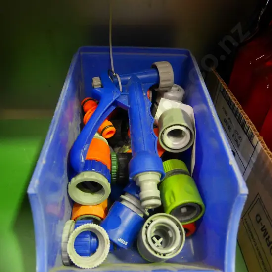 container of garden hose fittings