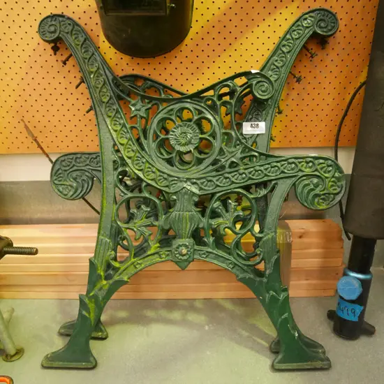 green painted cast iron garden bench seat ends with wooden slats - needs to be assembled