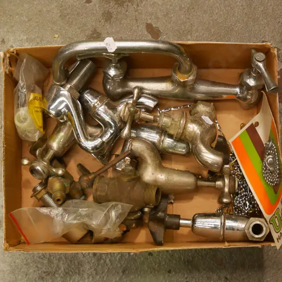 box of plumbing supplies, plug chains etc