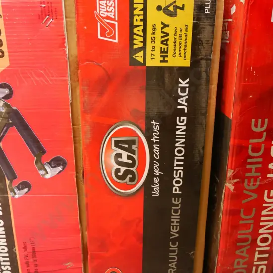 hydraulic vehicle positioning jack