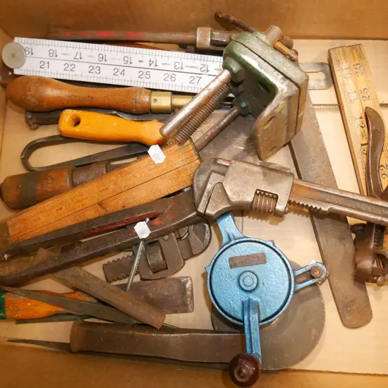 box of vintage tools; small vice, stilsons etc