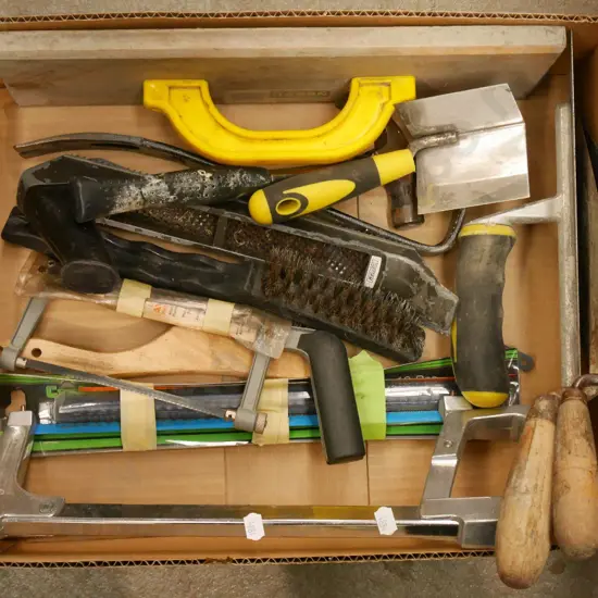 box; plastering trowels, hack saws etc