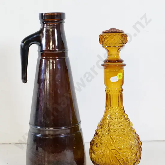 retro amber glass stoppered bottle H-320 and a heavy brown glass tall handled bottle