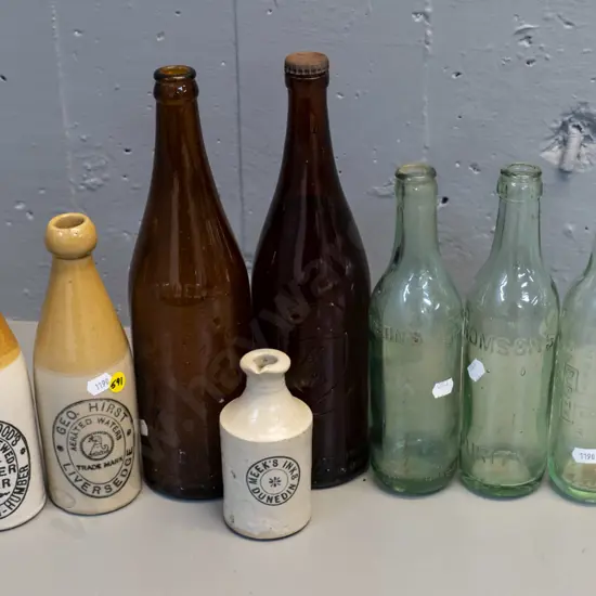 8 vintage bottles - one Meek's Dunedin stoneware ink bottle, 2 others, 2 English ginger beer, NZB, Powley, Lane-Thompson