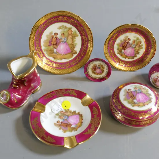 7 small pieces of Limoges burgundy & gold w/classical motif - larger plate is D-110
