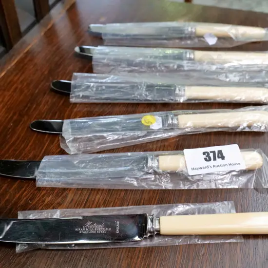 set of 6 bone-handled dinner knives marked Sheffield England