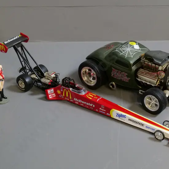 2 die-cast model cars - Muscle Machine Ford Black Widow, figurine, and an Action drag racer L-420