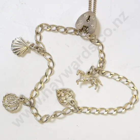 silver charm bracelet with horse, heart, the letter D & shell charms - clasp stamped 925