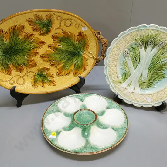 3 Majolica items - asparagus plate, oyster dish, and a leaf-handled platter