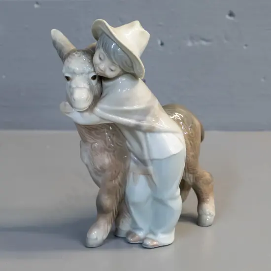 Lladro figure - boy with donkey, No. 10 - H-210 L-170