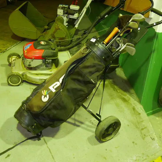 golf clubs and trundler