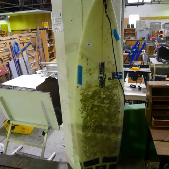 beaten up surfboard - missing fin