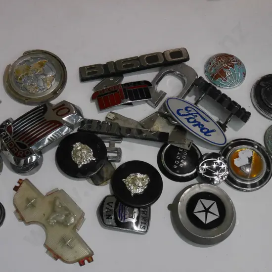 box of various car badges