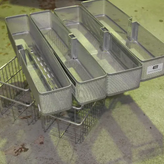 Elfa utility storage baskets and wall brackets