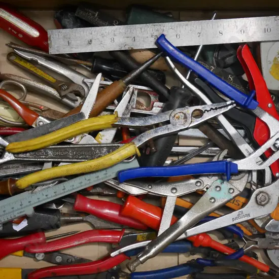 box; plumbers wrenches, vice grips etc