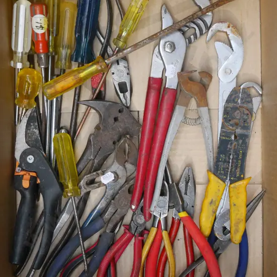 box;  universal spanners, screwdrivers, pliers etc