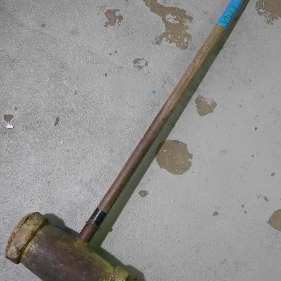 vintage wooden sledge hammer