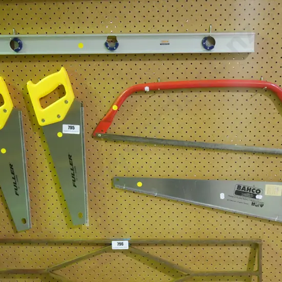 4 hand saws, builder's level - yellow dots