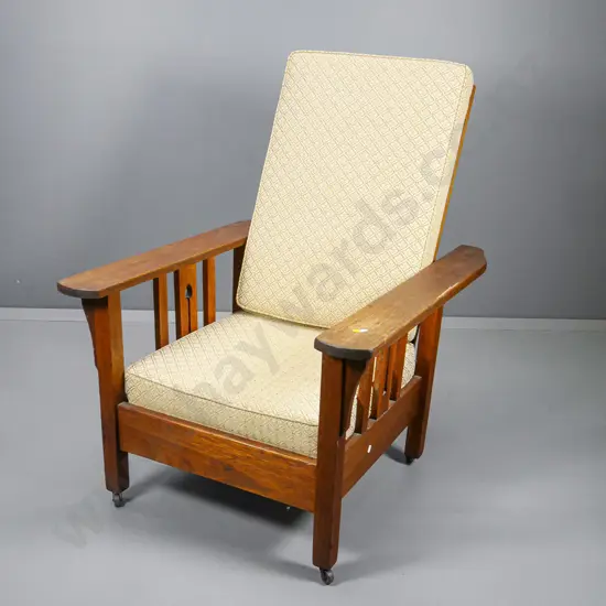 oak arts & crafts Morris chair with beige damask covered squabs, on casters H1030 W750 D900