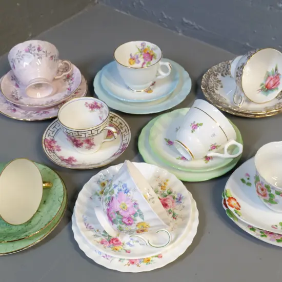 7 English trios and 1 cup & saucer - Royal Doulton, Royal Albert, etc.