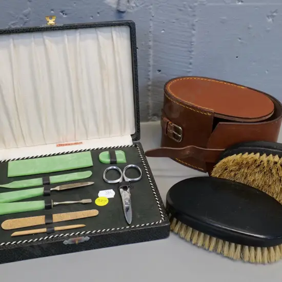 retro cased English nail set and leather-cased pair of ebony hair brushes