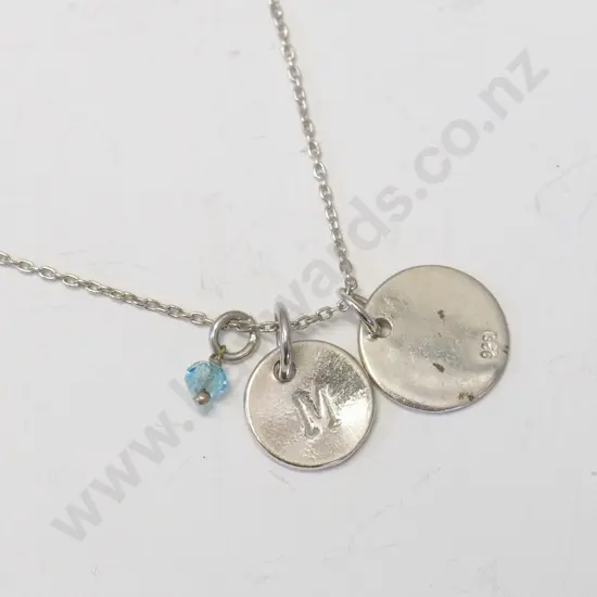 silver necklace with the letter 'M' stamped 925