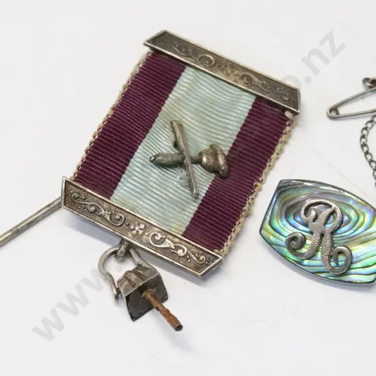 silver paua shell brooch with the letter R & a masonic medal