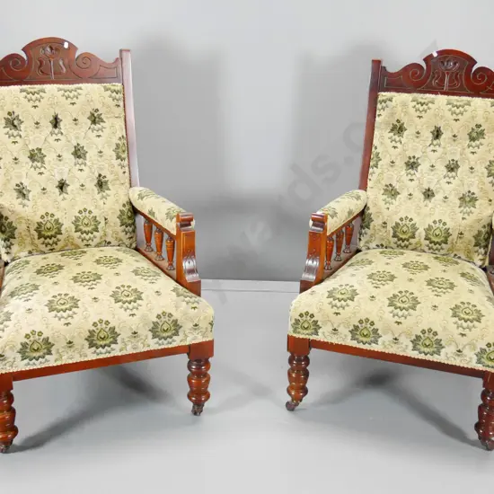 pair of Edwardian mahogany armchairs w/ spindle arms, carved detail, porcelain casters, embossed velvet H1100 W650 D680